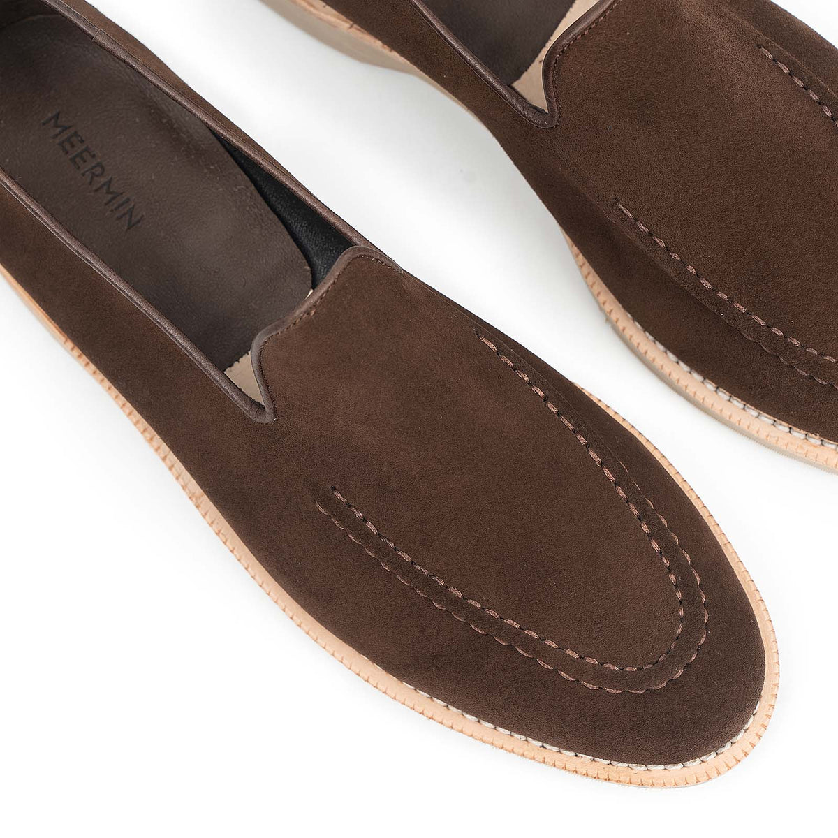 Meermin brown Superbuck suede unlined loafers, close-up on toe apron stitching and taupe rubber sole edge