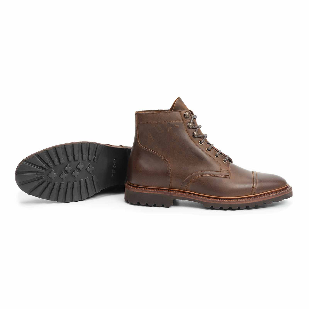 Meermin tobacco waxy calf cap-toe boot, side profile with paired sole shown, displaying lug rubber sole tread and cap-toe stitching