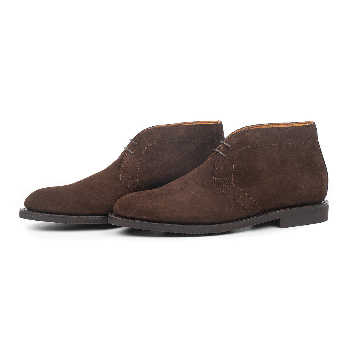 Meermin brown suede chukka boots, three-quarter side view showing both pairs, flex Goodyear welted soles and lace detailing