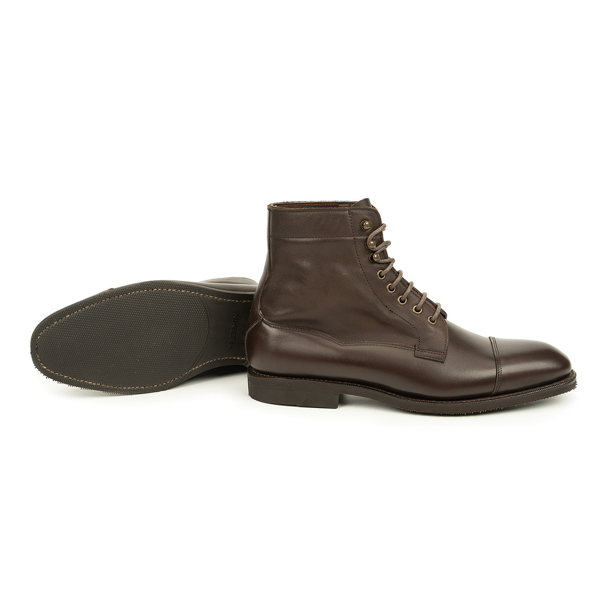 Meermin brown boxcalf cap-toe boot shown paired with its sole facing up, displaying the diamond latex rubber tread