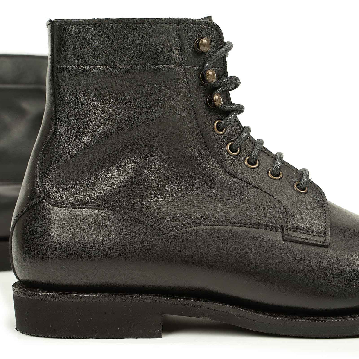 Meermin black boxcalf boot, close-up on lace eyelets and heel, showing softcalf shaft and flex Goodyear welted sole