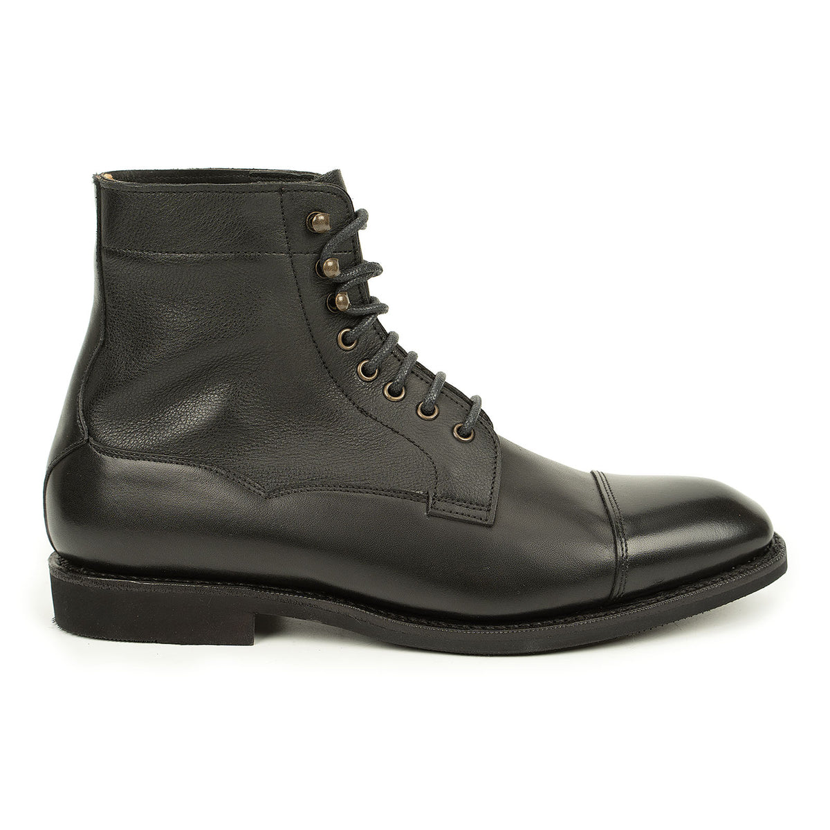Meermin black cap-toe boot, side profile view showing softcalf shaft, boxcalf toe cap, lace-up eyelets, and rubber sole