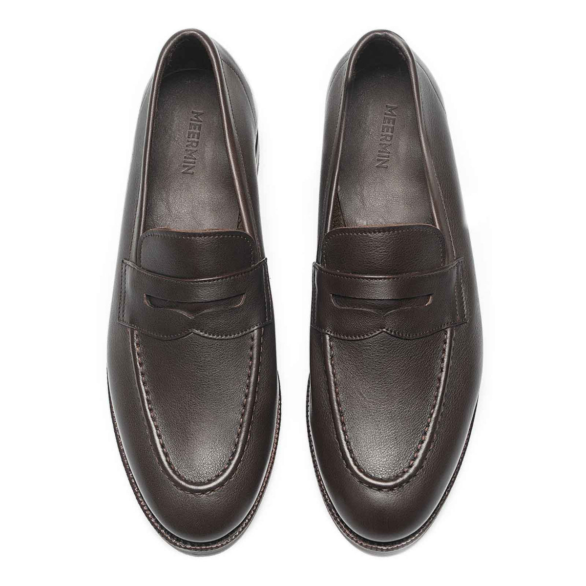 Meermin brown softcalf penny loafers, top-down view of both shoes showing round toe shape and saddle strap detail