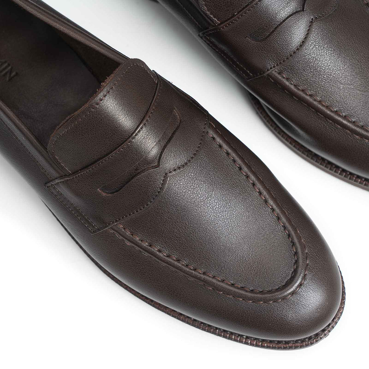 Meermin brown softcalf penny loafers, close-up on toe apron and strap stitching detail