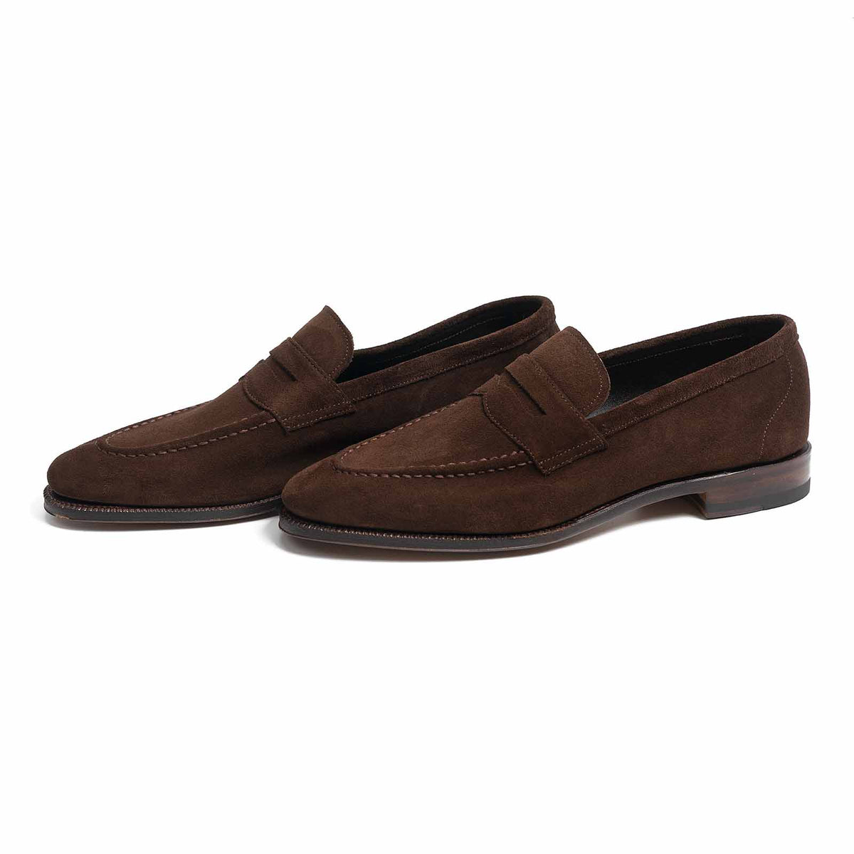 Meermin brown Superbuck suede penny loafers, pair shown at three-quarter angle showing unlined construction and flex Goodyear welted sole