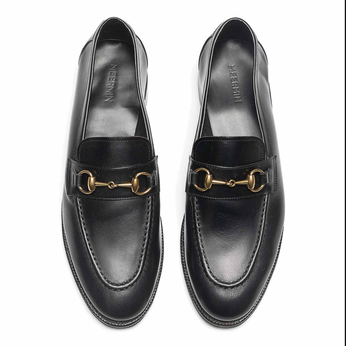 Meermin black boxcalf horsebit loafers, top-down view of both shoes showing gold hardware and round toe silhouette