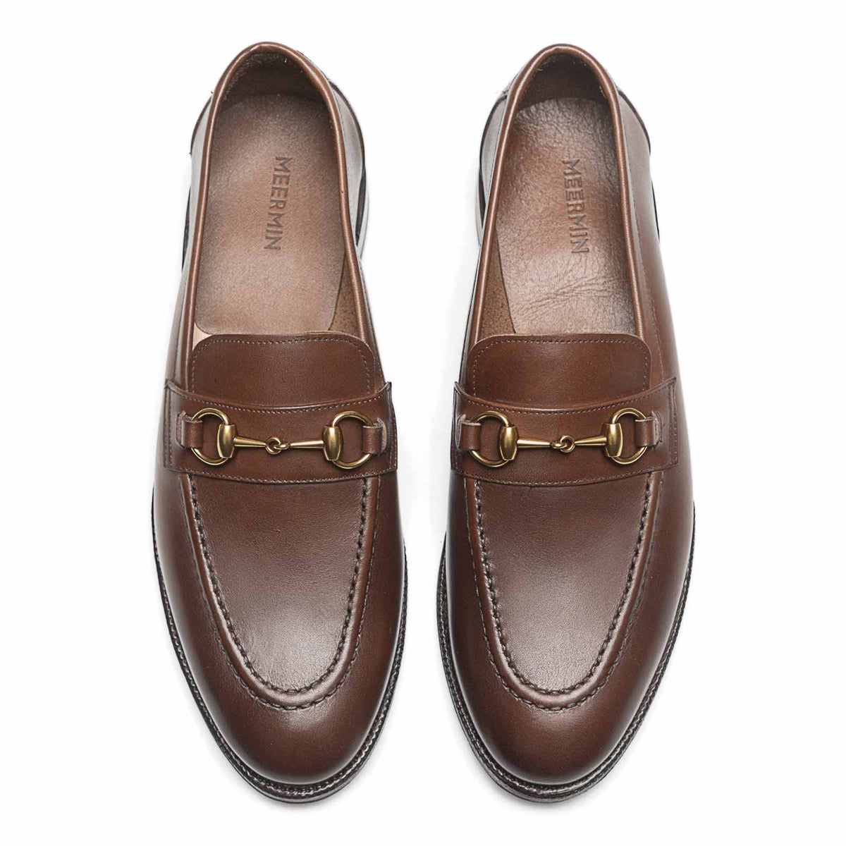 Meermin oak antique calf horsebit loafers, top-down view of both shoes showing brass bit hardware and apron stitching