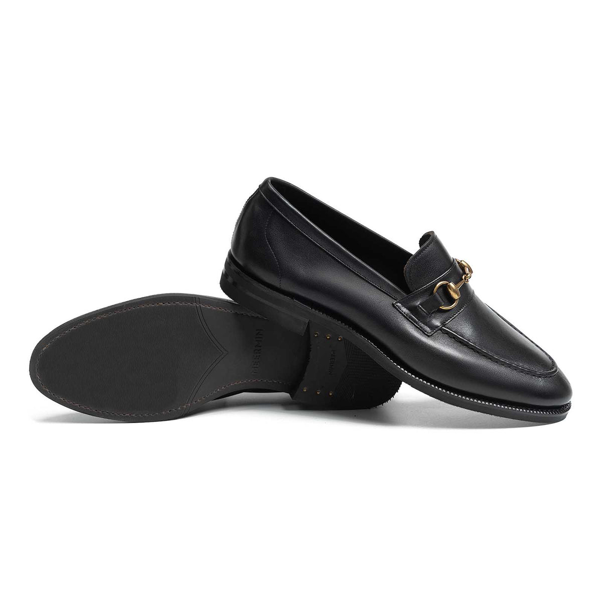 Meermin black softcalf horsebit loafers, side profile with one shoe overturned to show the city rubber sole and heel