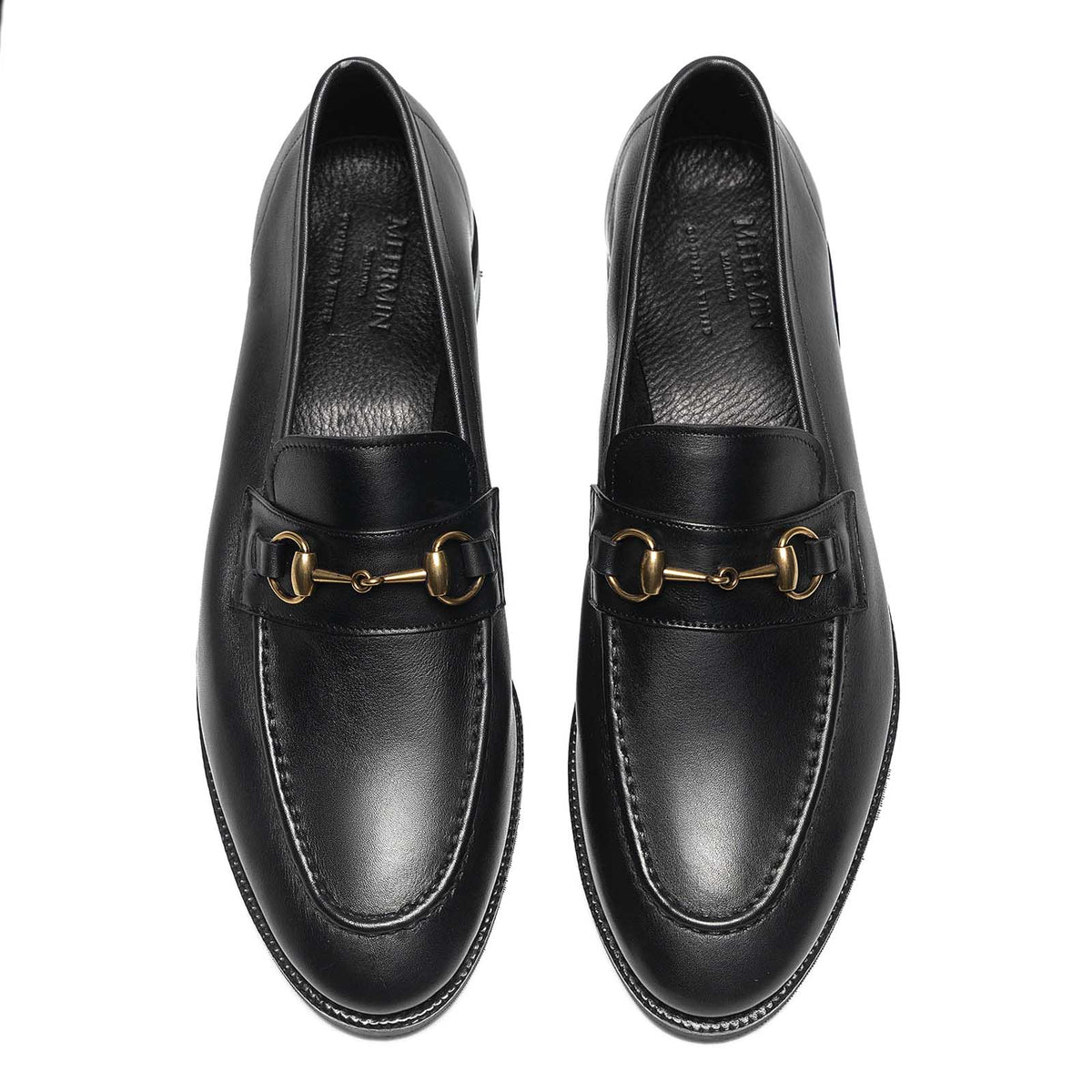 Meermin black softcalf horsebit loafers, top-down view of both shoes showing gold-tone bit hardware and round toe shape