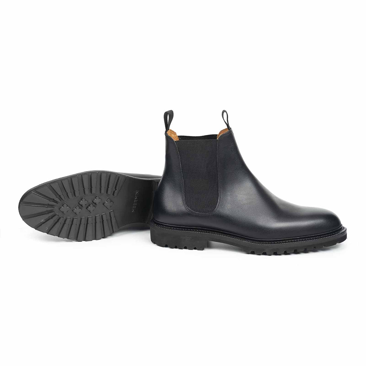 Meermin black boxcalf Chelsea boot, side profile with matching pair showing lugged rubber sole tread