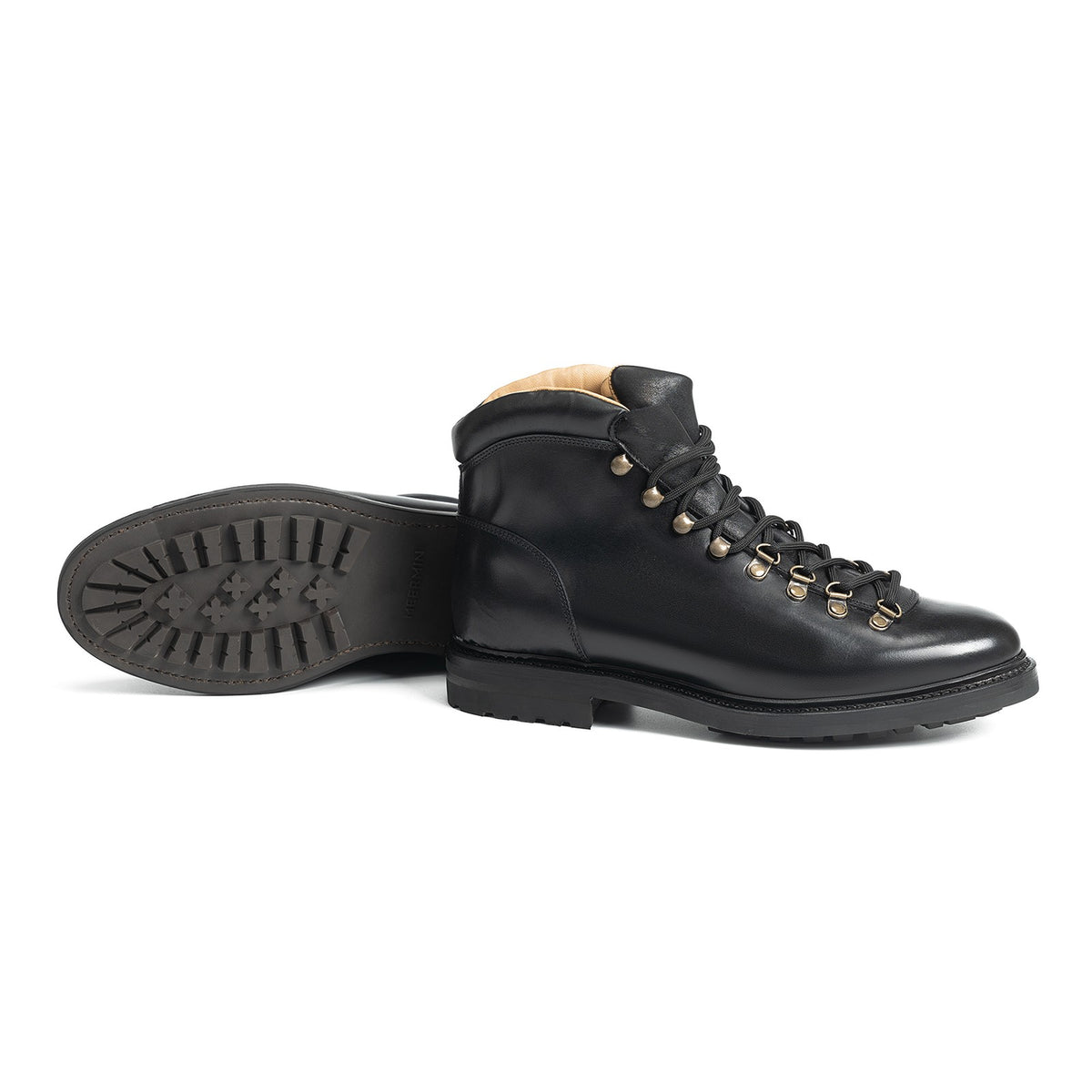 Meermin black calf hiking boot, side profile with mate lying sole-up, showing lugged rubber sole and lace hooks