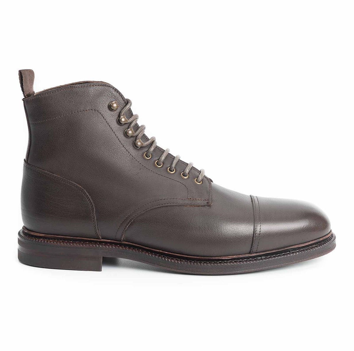 Meermin brown softcalf cap-toe boot, side profile view showing lace-up front, pull tab, and studded rubber sole